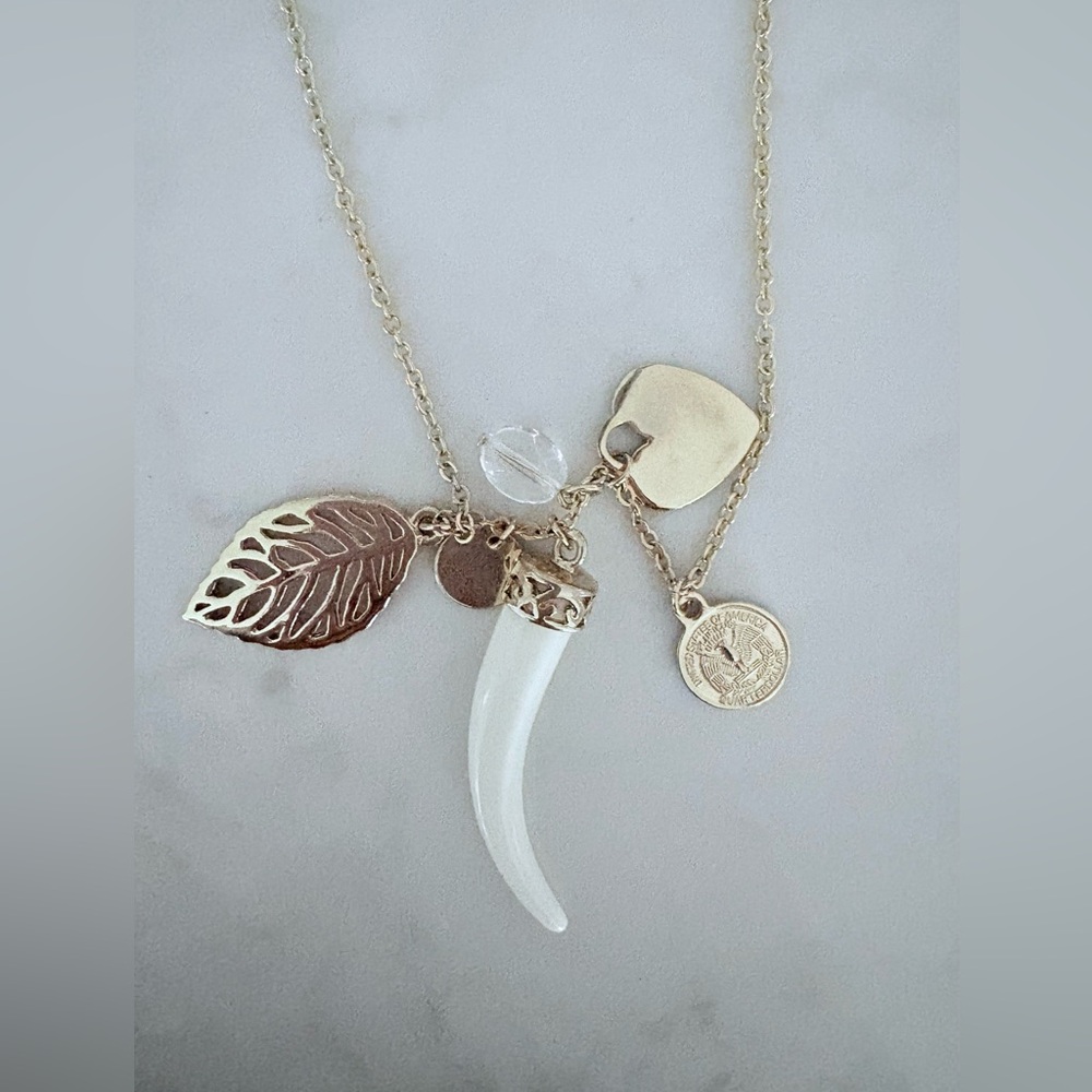 Cookie Lee Gold Charm Necklace and Faux Ivory Tusk Charm